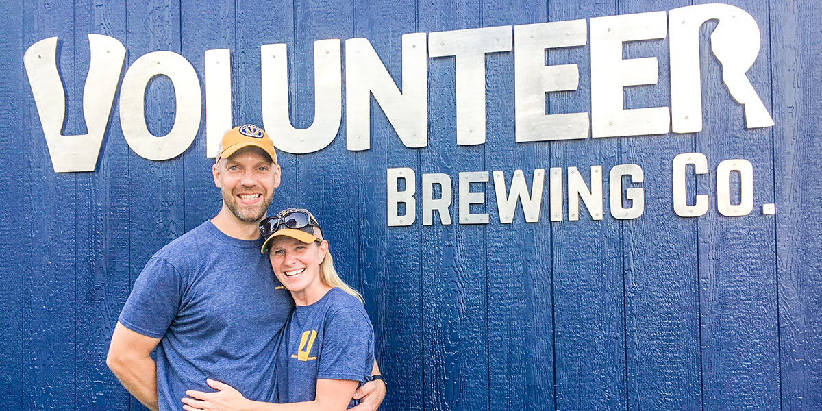 volunteer brewing co exterior with couple embracing